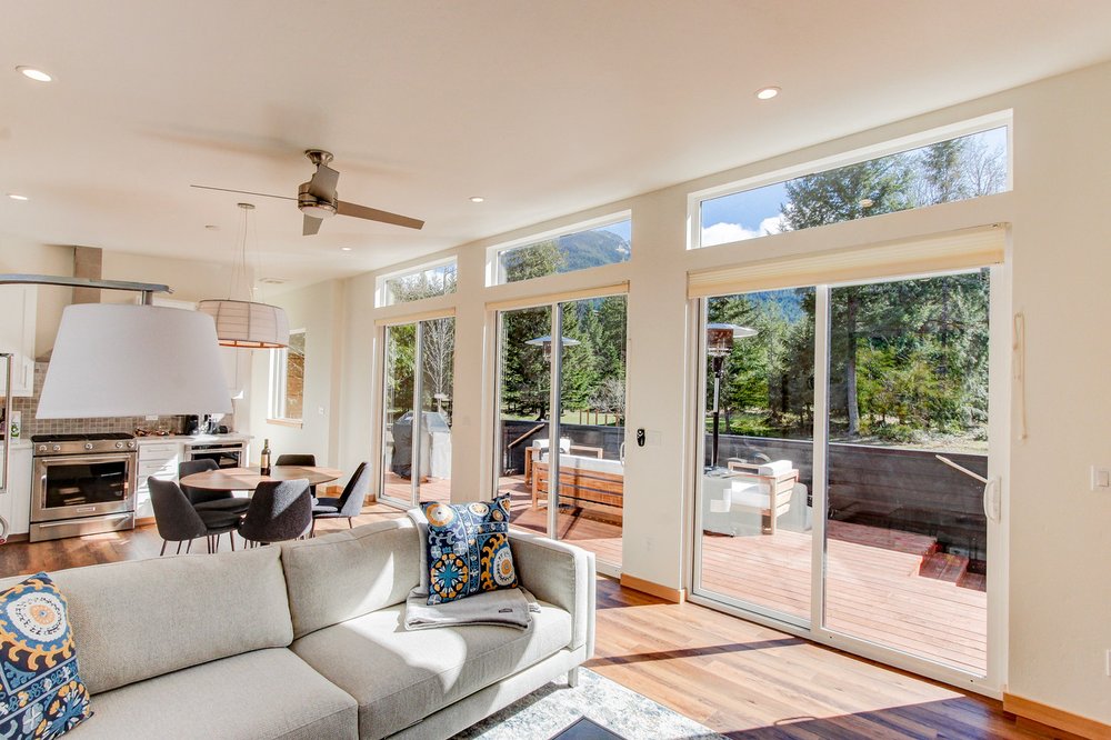Bright open-plan living room in a modern prefab home with comfortable seating.
