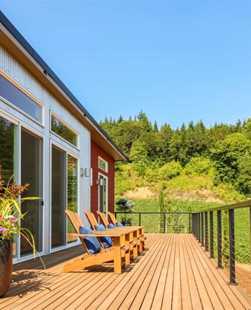 Modern deck with Adirondack chairs and railing at Bryn Mawr Vineyards Guest Cottage